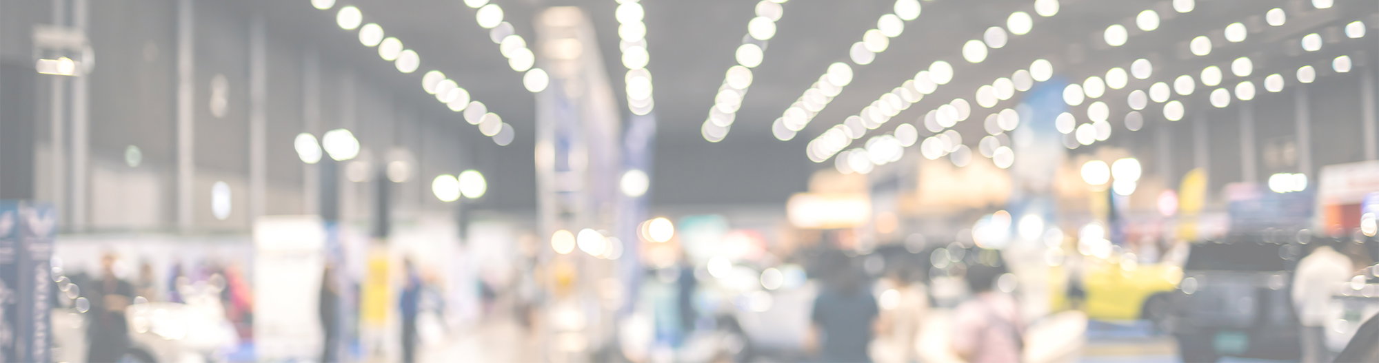 blurry showroom, autoshop background, light rows, trade show hall, consumer atmosphere